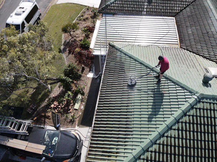 Pressure washing Brisbane tiled roof in progress