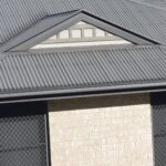 gutter guard mesh on grey metal roof