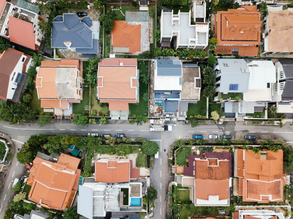 Aerial shot of corrugated, tile and metal roofs of Brisbane houses