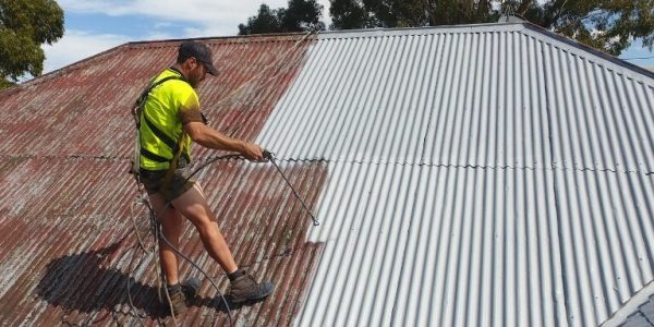 gutter guard guys painting roof as part of roof restoration service